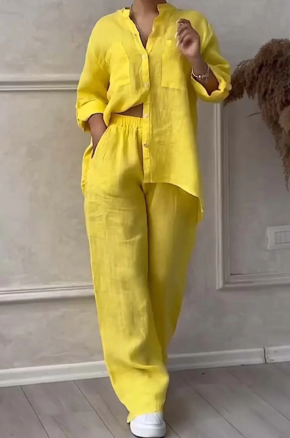 Person wearing a bright yellow outfit in an indoor setting
