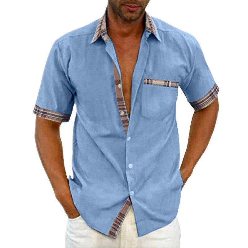 Man wearing a light blue short-sleeve shirt with plaid accents on a white background