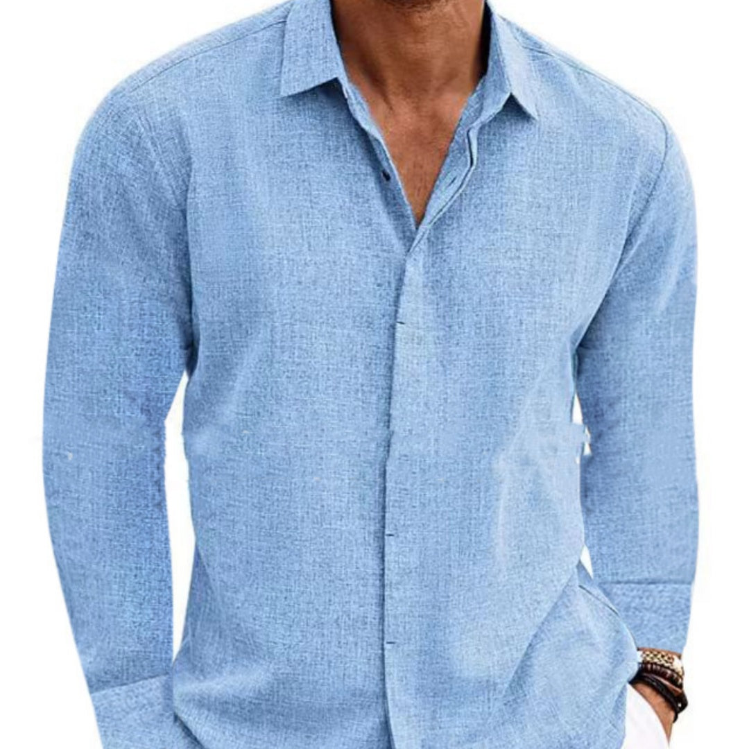 Light blue button-up shirt worn by a person on a white background