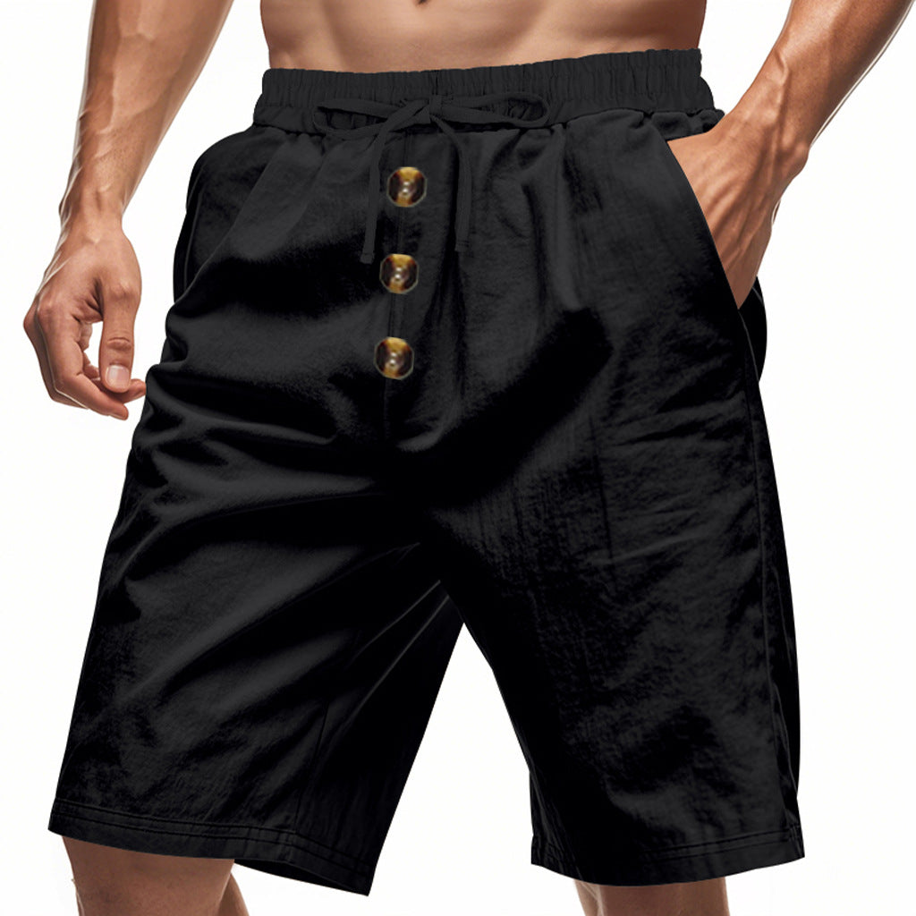 Black shorts worn by a person on a white background
