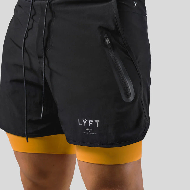 Black athletic shorts with a yellow waistband featuring the Lyft logo on a gray background.