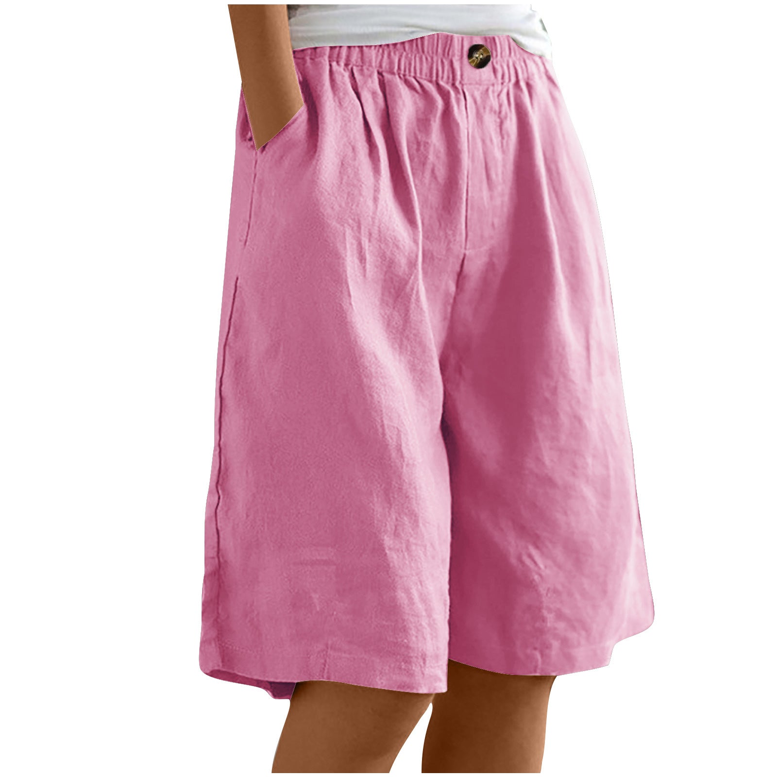 Pink shorts worn by a person on a white background