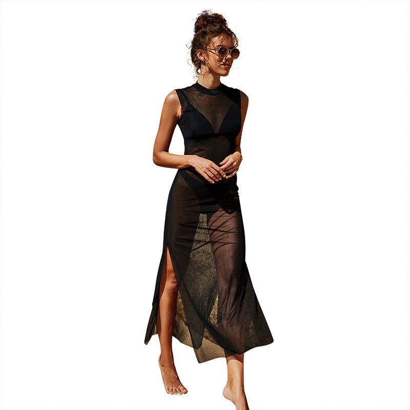 Woman wearing a black sheer dress with a white background