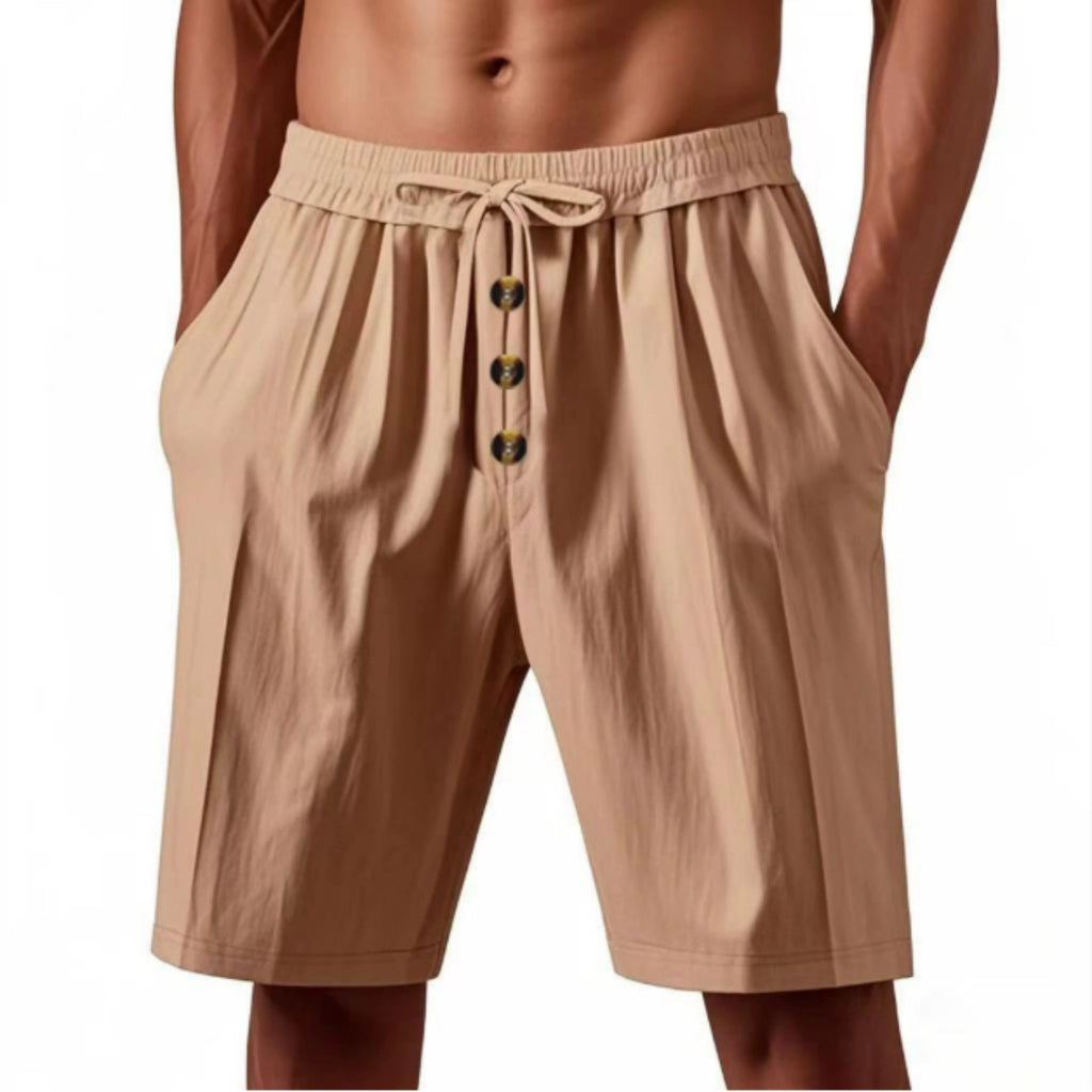 Beige shorts with button details on a white background