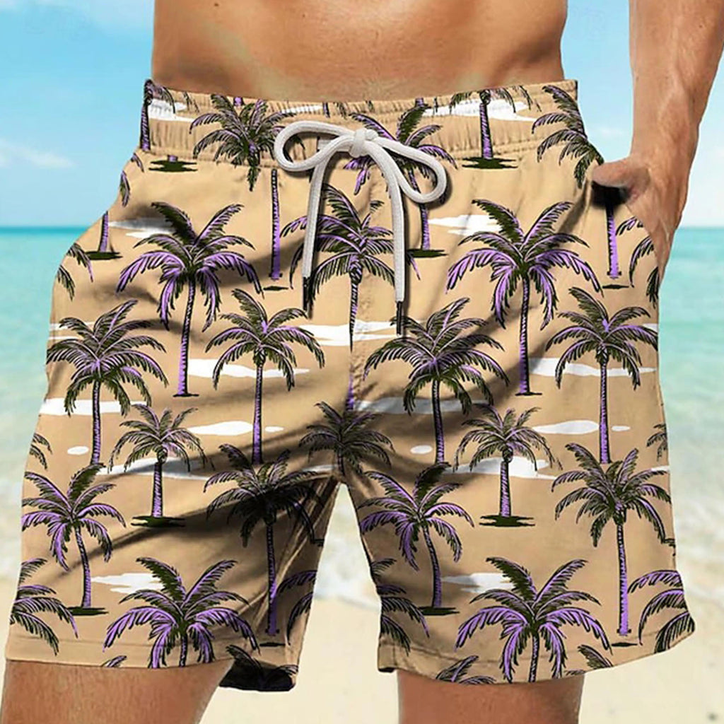 Beige shorts with palm tree pattern worn by a person against a beach background