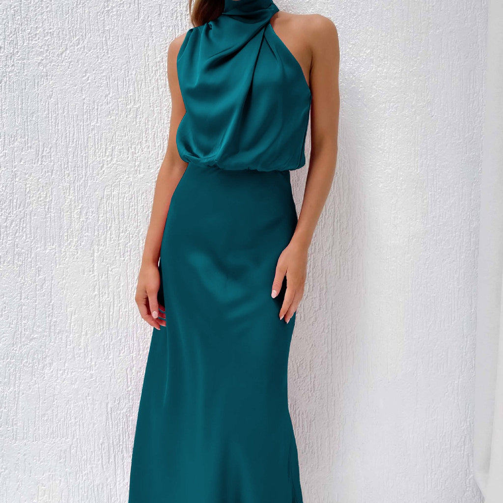Teal evening gown with a textured white background