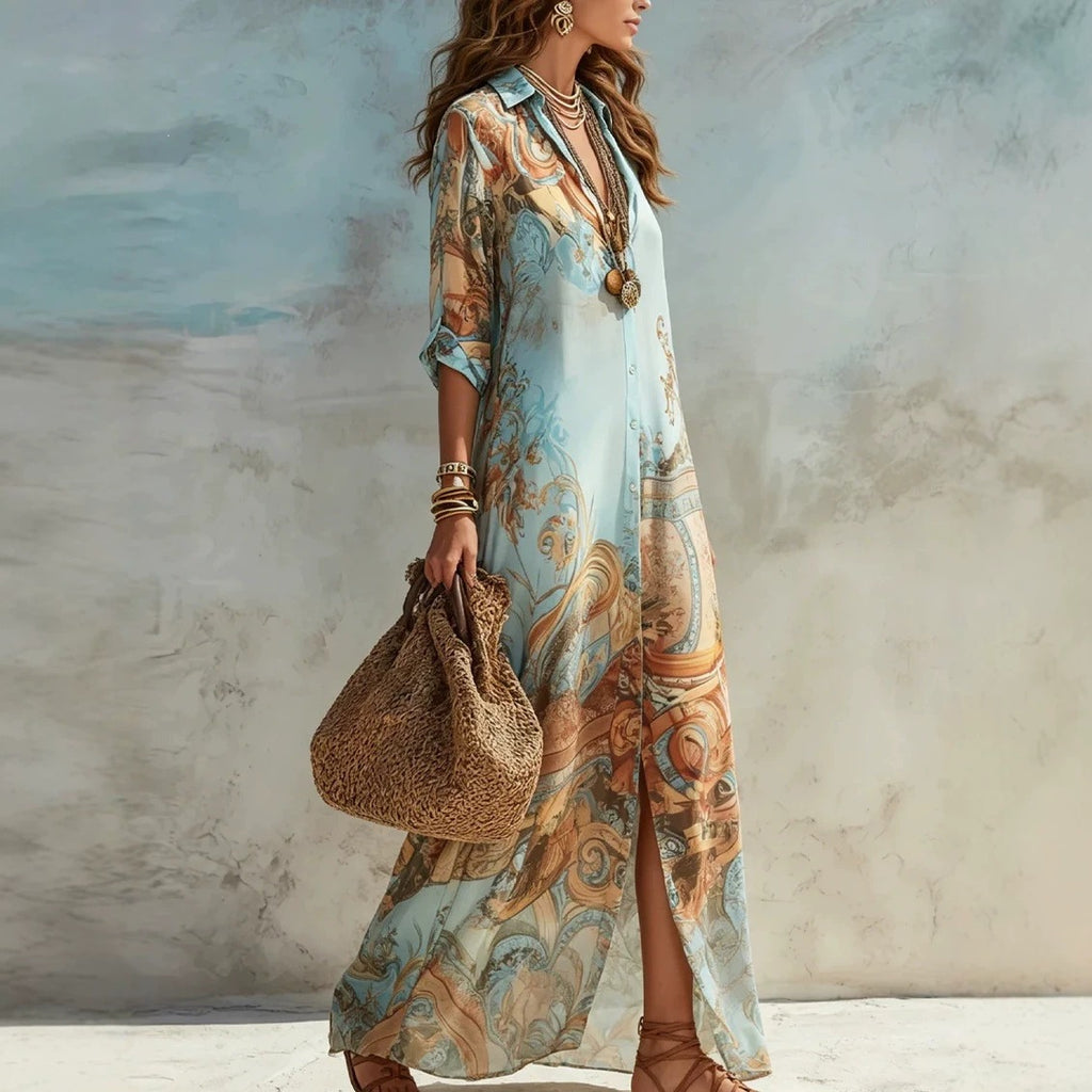 Woman wearing a long, patterned dress holding a woven bag against a textured wall.