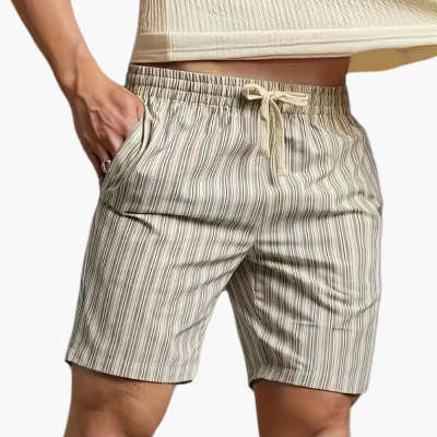 Striped shorts worn by a person on a white background