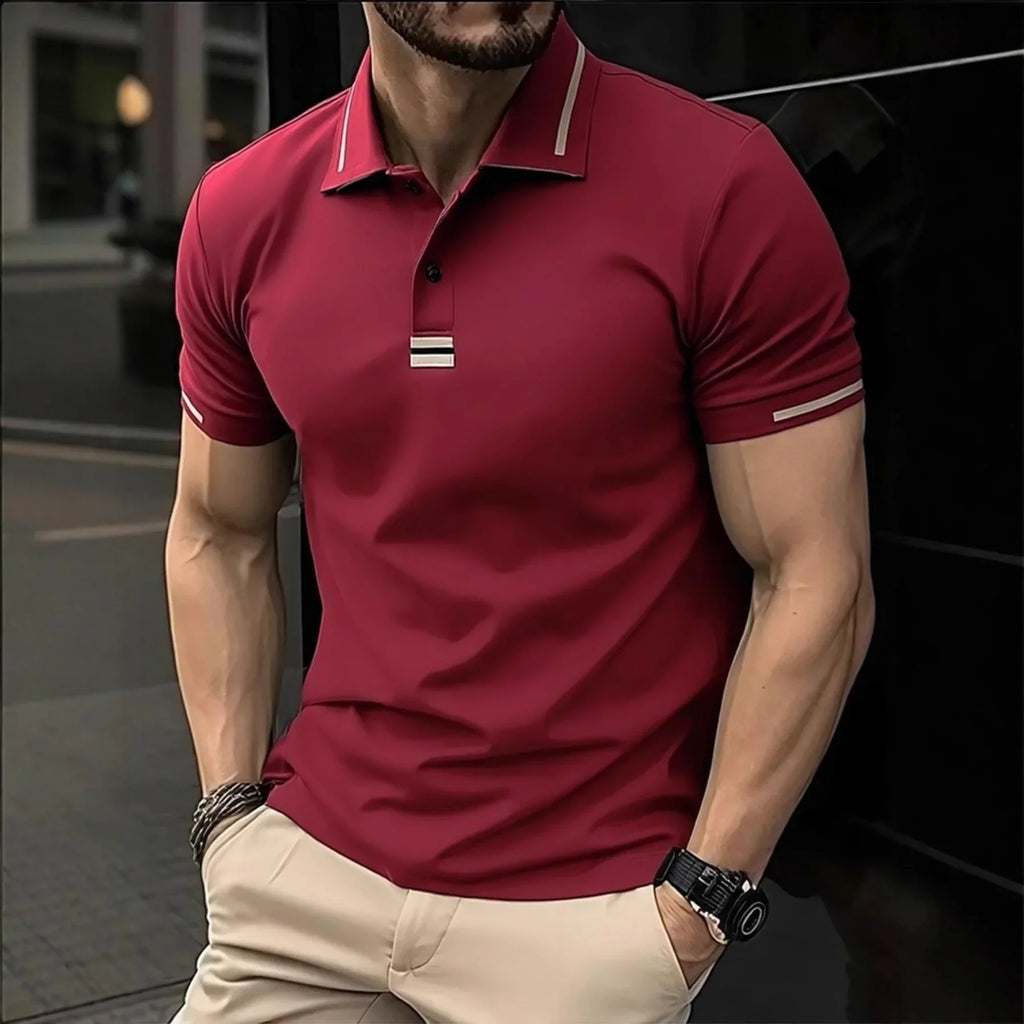 Man wearing a red polo shirt with a blurred background