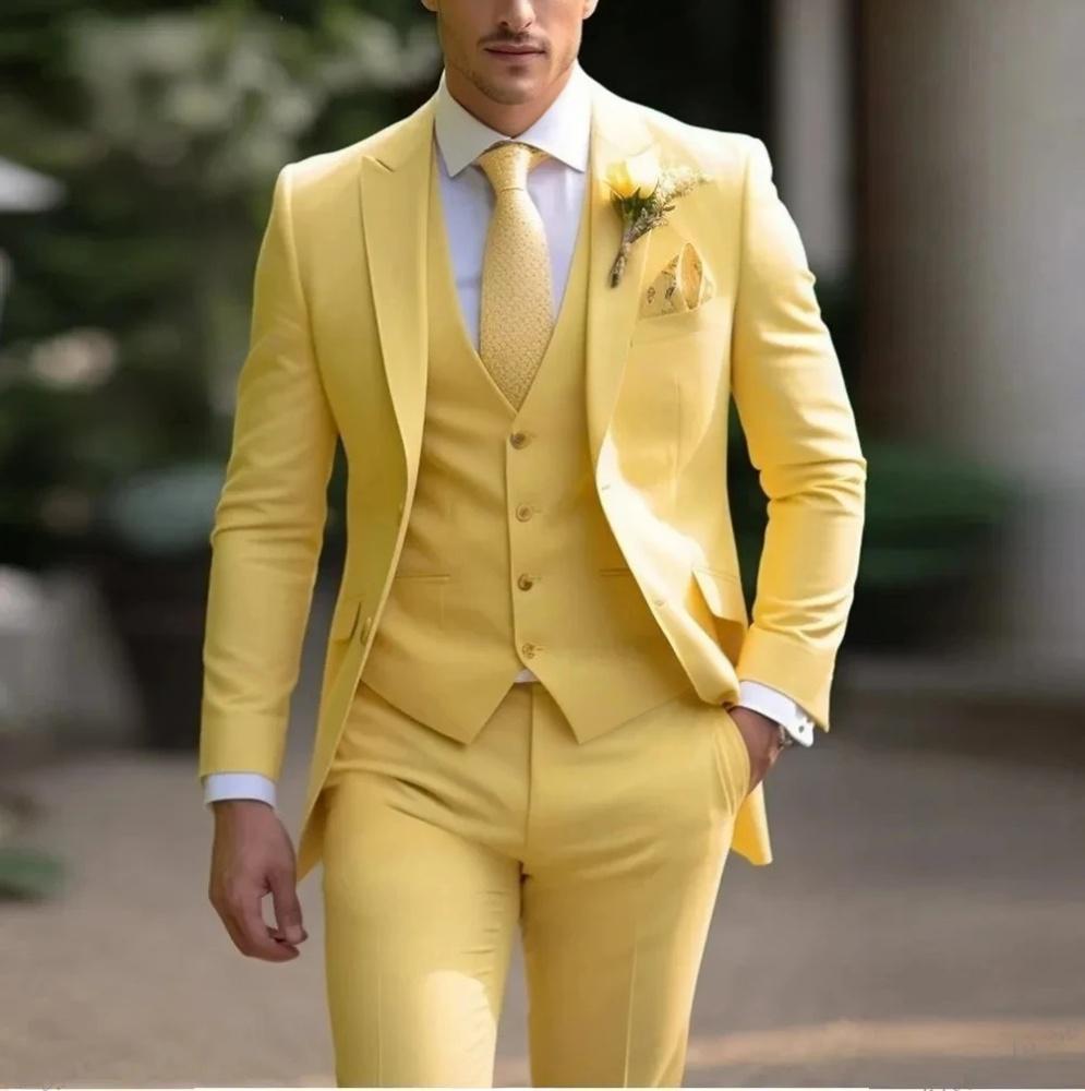 Man wearing a bright yellow suit with a tie and pocket square.