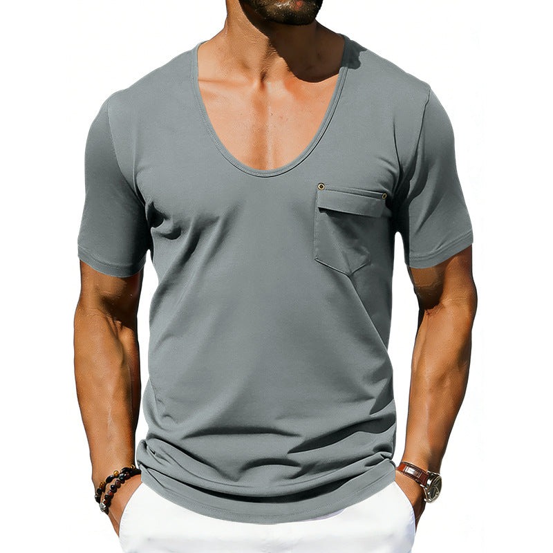 Man wearing a gray t-shirt with a pocket on a white background