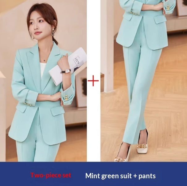Mint green suit with pants worn by a model indoors.