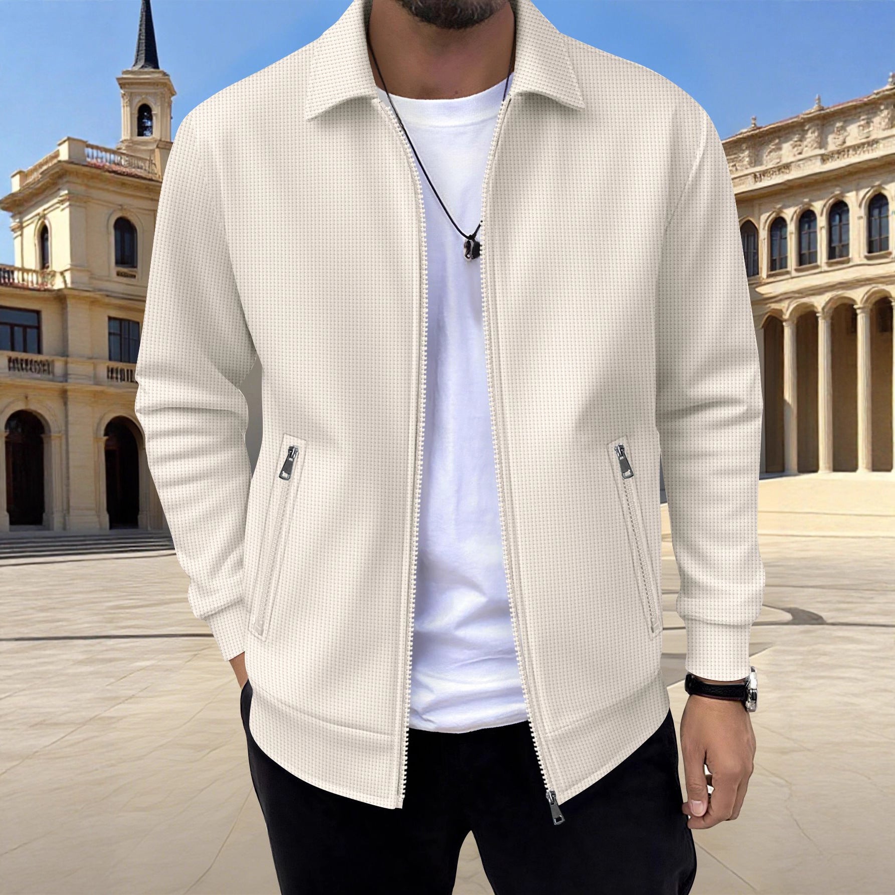 Man wearing a beige jacket over a white shirt with a classical building in the background
