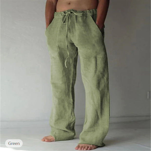 Green pants worn by a person on a plain background