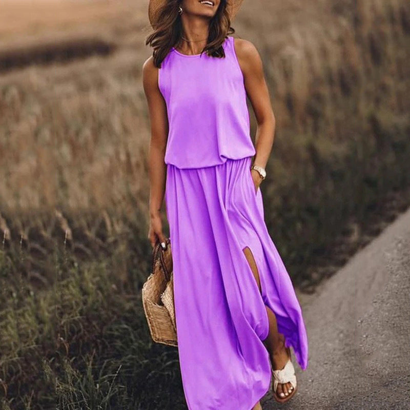 Woman in a purple dress walking on a path with a straw hat and basket.