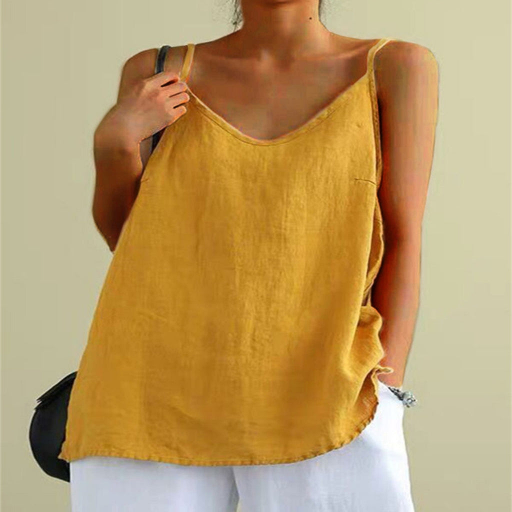 Person wearing a mustard yellow tank top against a plain background