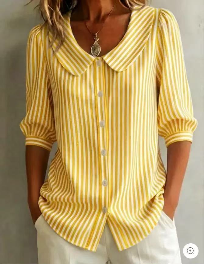 Yellow striped shirt worn by a person on a plain background