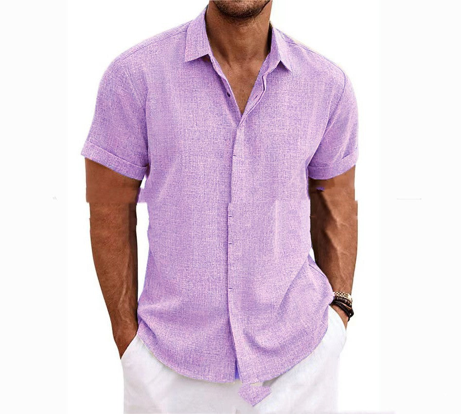 Man wearing a purple short-sleeve shirt with white pants on a white background