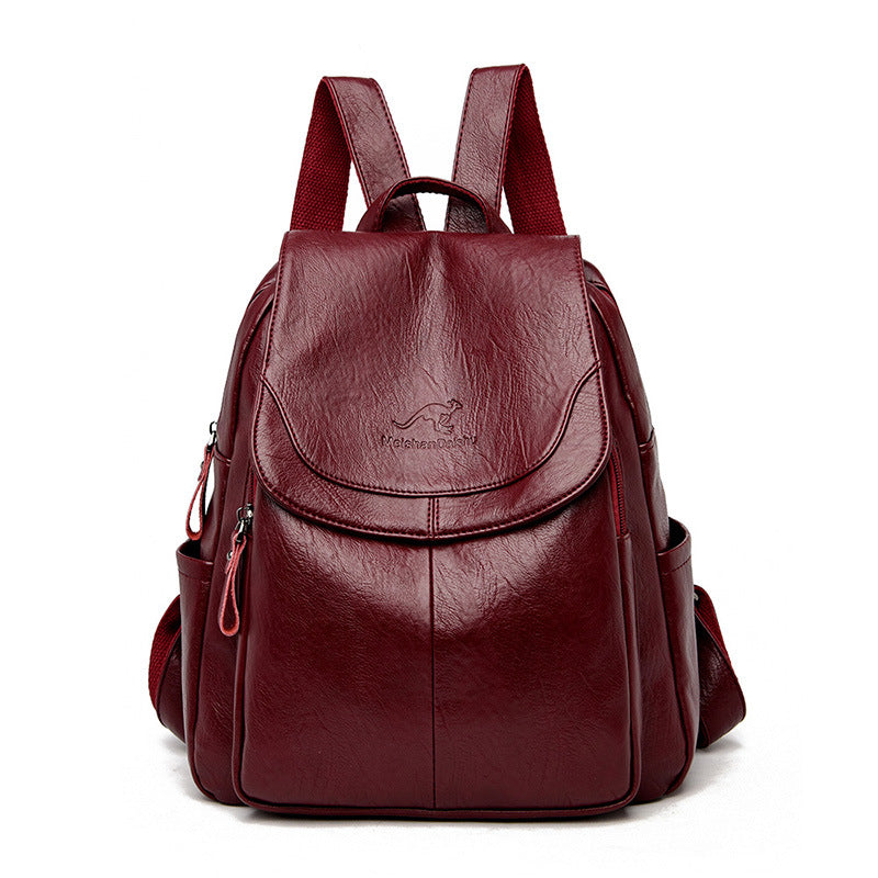 Maroon backpack with a visible brand logo on a white background
