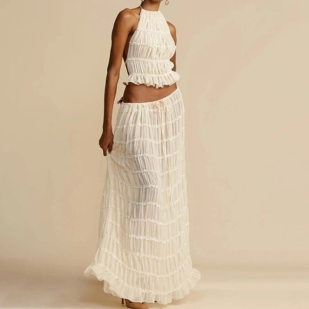White ruffled dress on a plain background