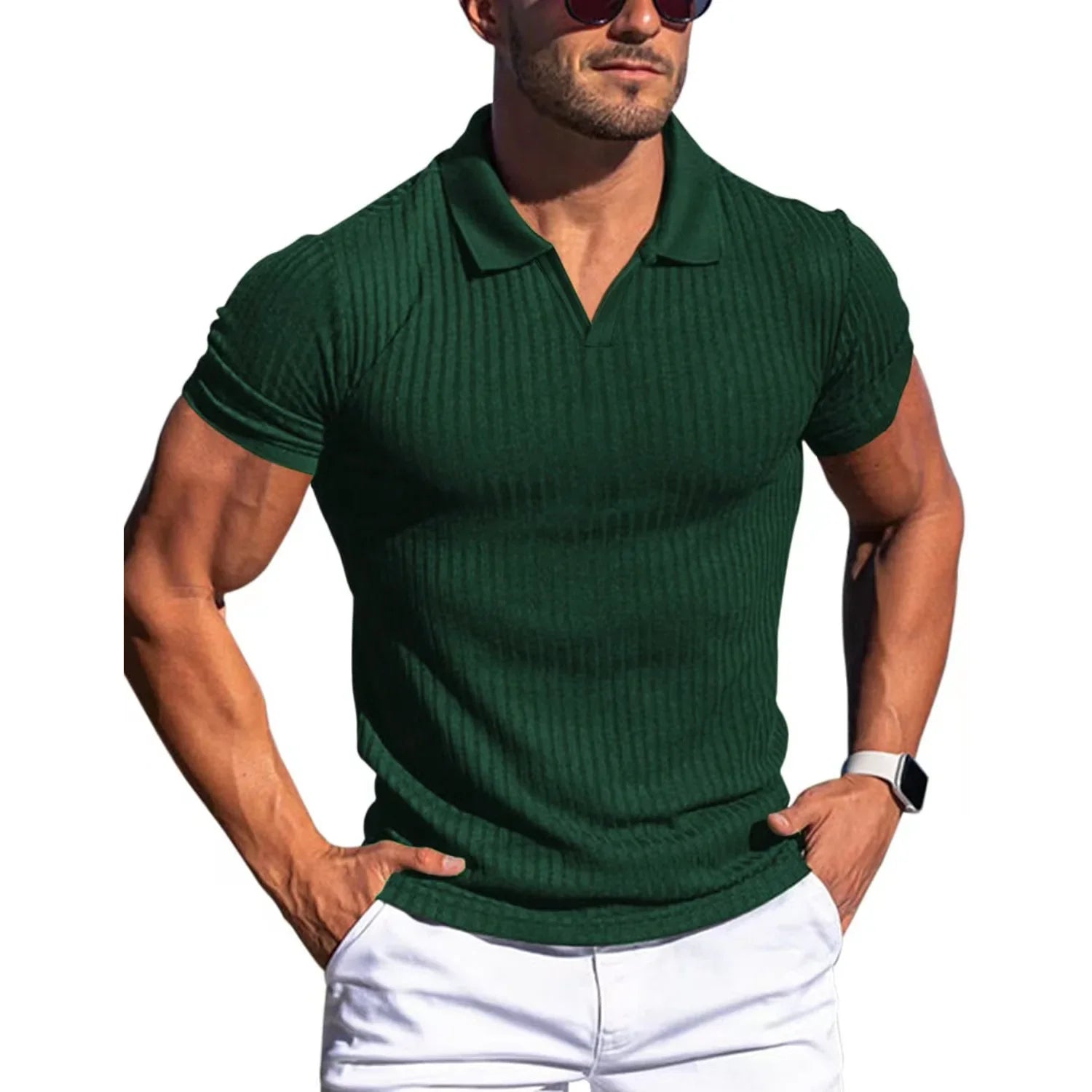 Man wearing a green ribbed polo shirt and white pants on a white background
