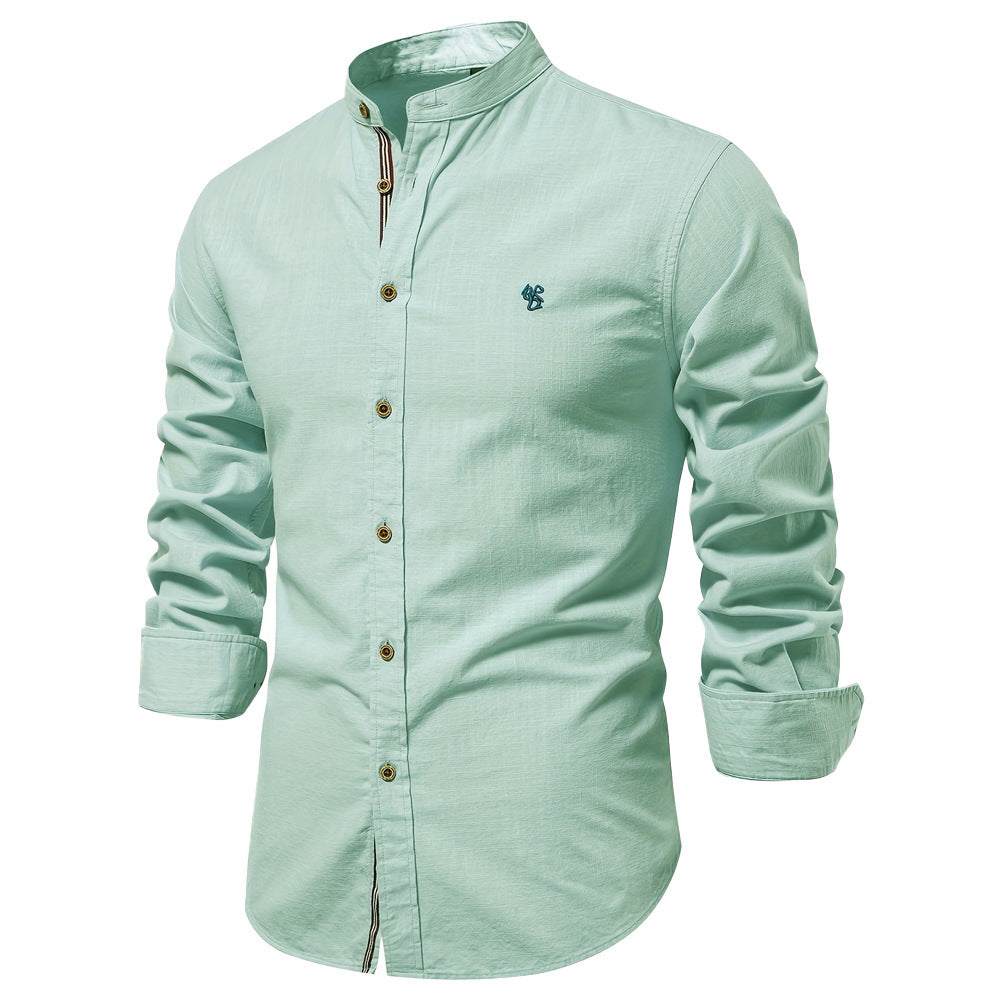 Light green shirt with rolled-up sleeves on a white background