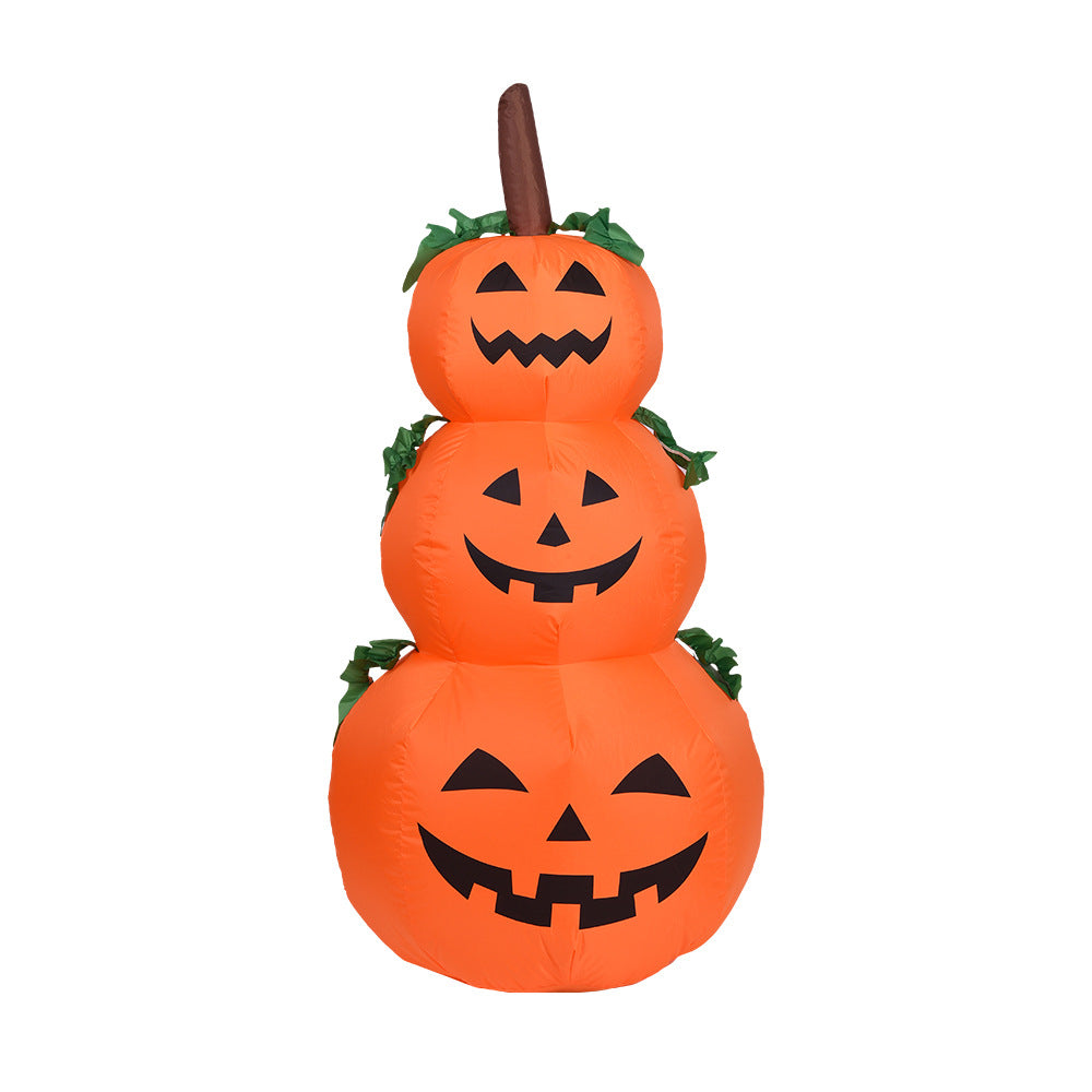 Stack of three inflatable pumpkins with jack-o'-lantern faces on a white background