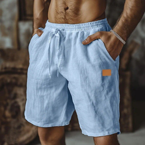 Light blue shorts with a small brown patch on a blurred background