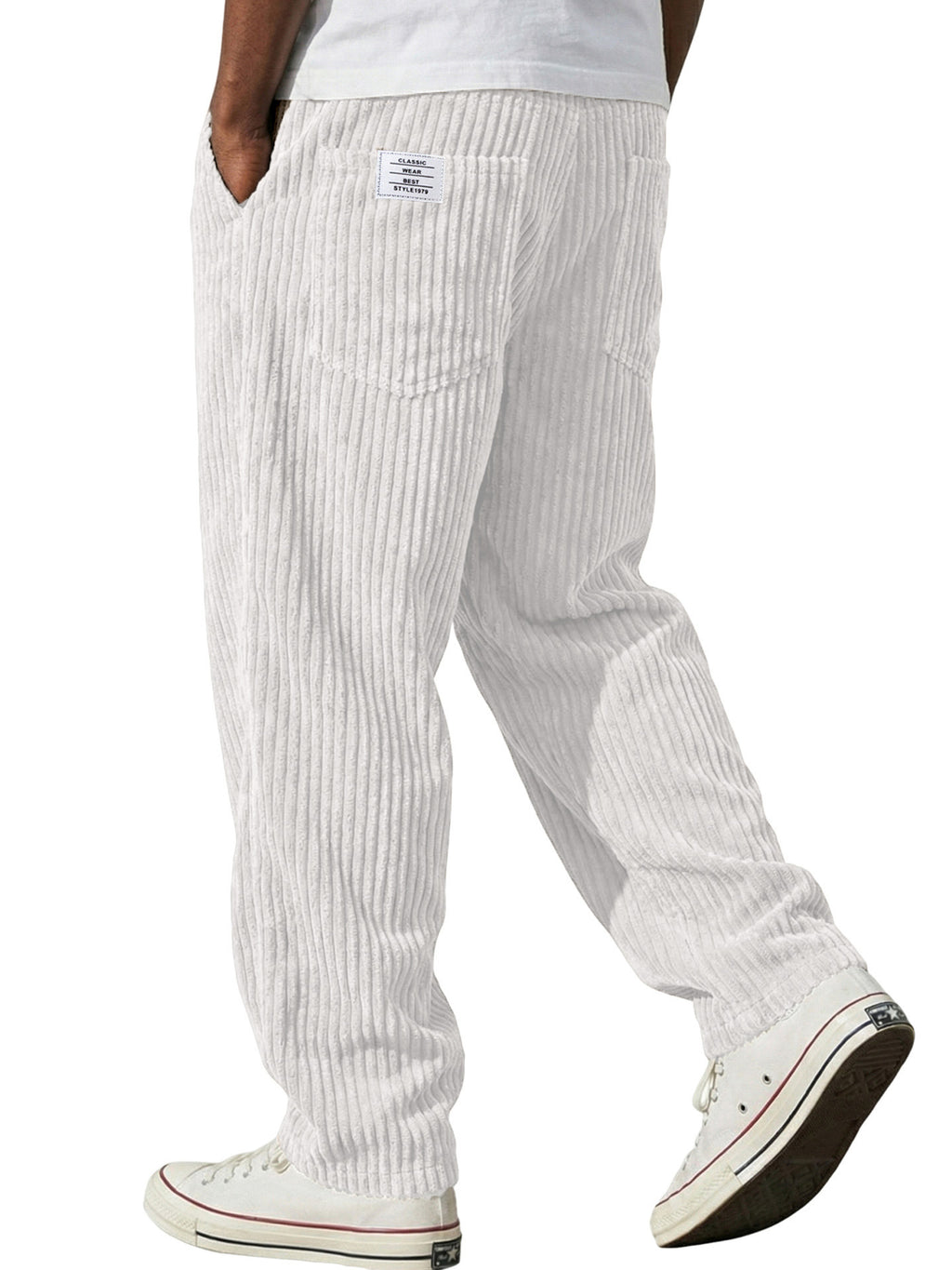 White striped pants worn by a person on a white background