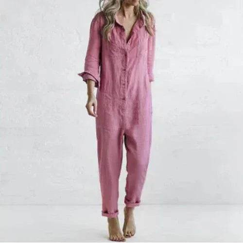 Woman wearing a pink button-up jumpsuit, barefoot, against a plain white background. ZA-Zola fashion.