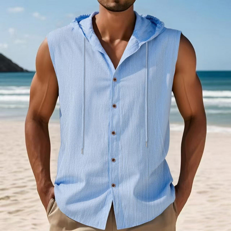 Man wearing a light blue sleeveless shirt with buttons on a beach