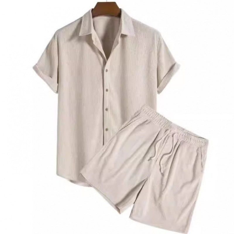 Beige pajama set with shirt and shorts on a white background