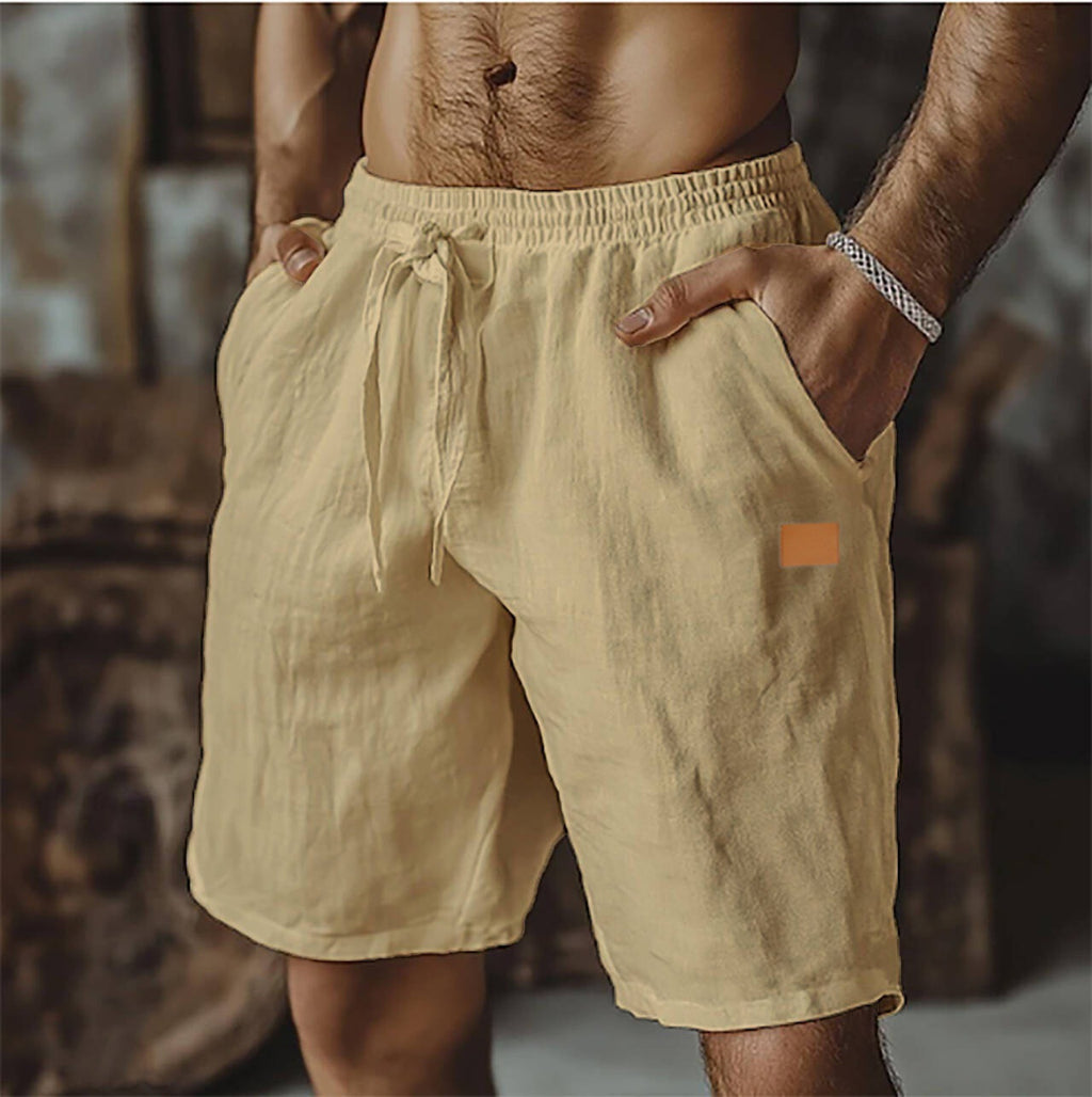 Beige shorts worn by a person with a blurred background