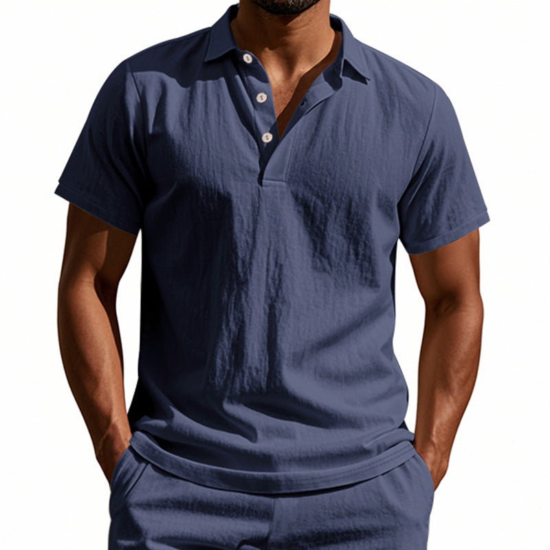 Man wearing a navy blue polo shirt on a white background