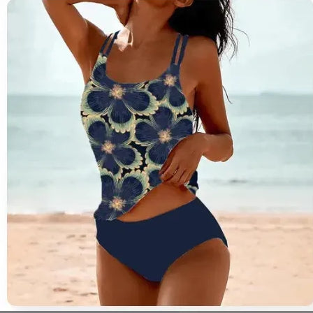 Woman wearing a blue floral swimsuit on a beach