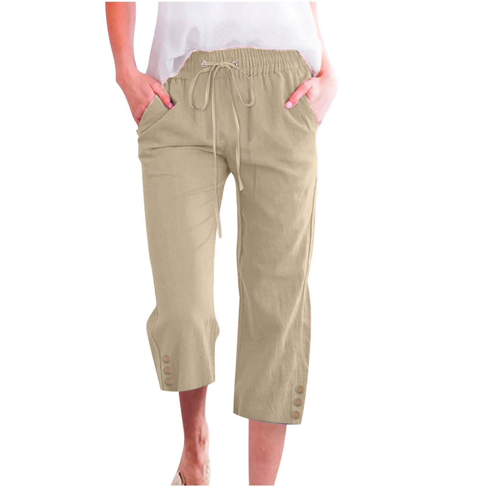 Beige capri pants worn by a person on a white background
