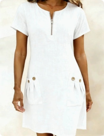 White dress with gold buttons on a neutral background
