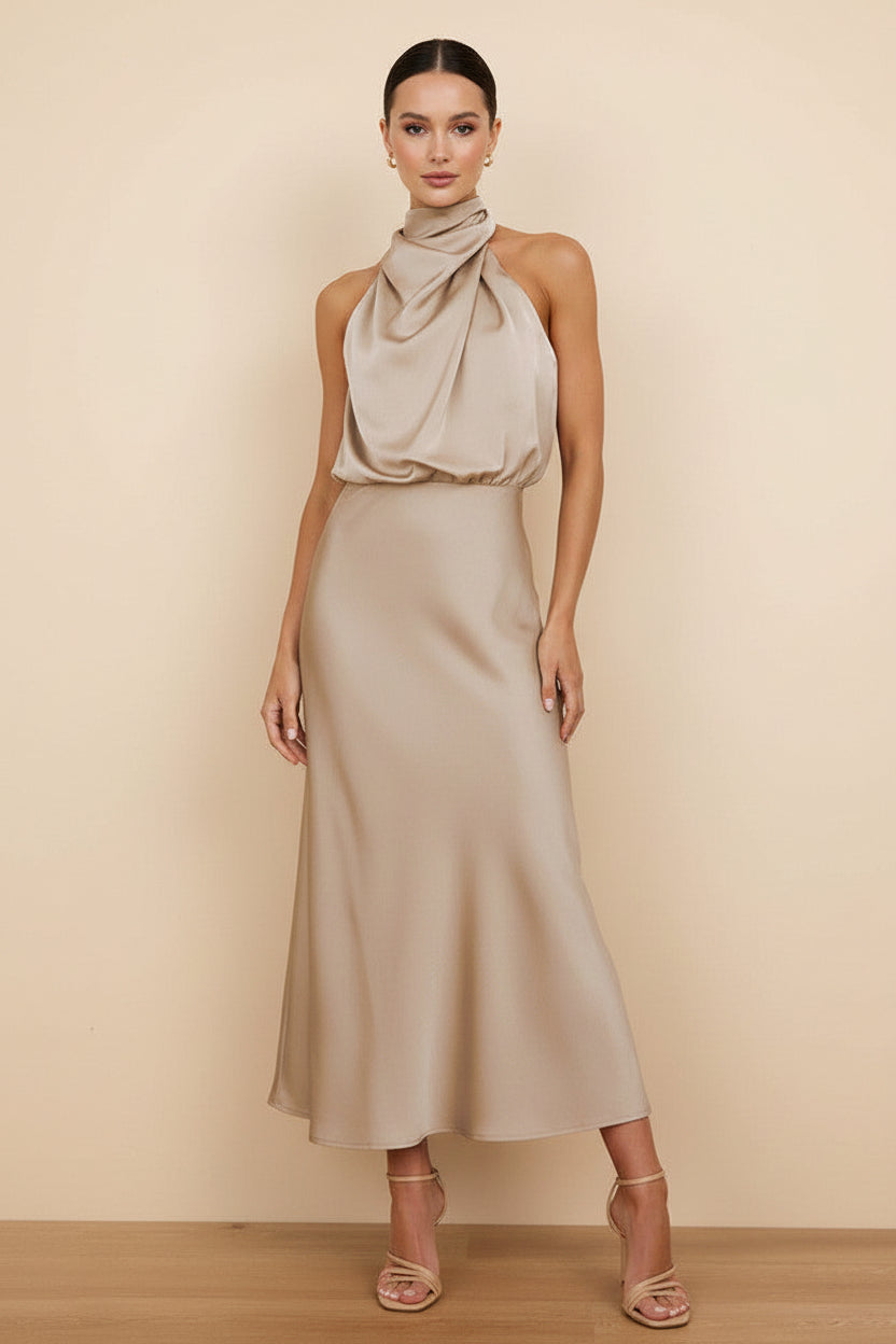 Woman wearing a beige halter neck dress with color options displayed on the right.