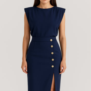 Navy blue dress with button details on a plain background