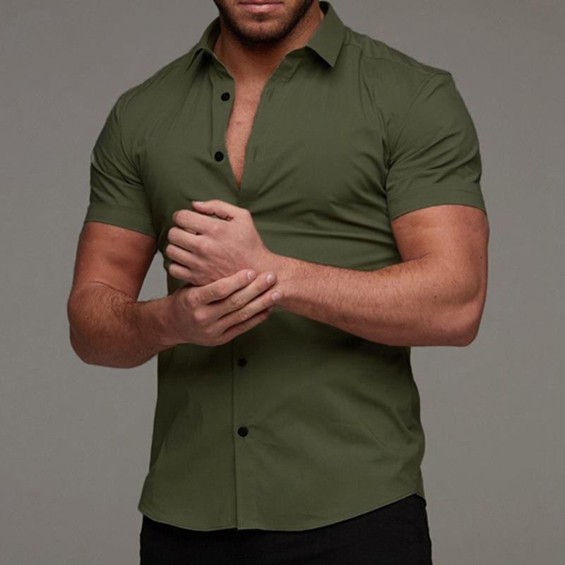 Man wearing a green shirt against a gray background