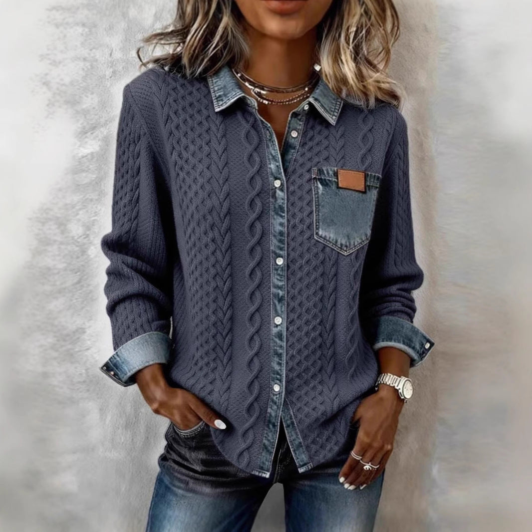 Person wearing a textured blue shirt with denim collar and cuffs against a neutral background
