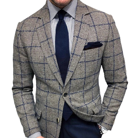 Plaid blazer with navy tie and pocket square on a white background