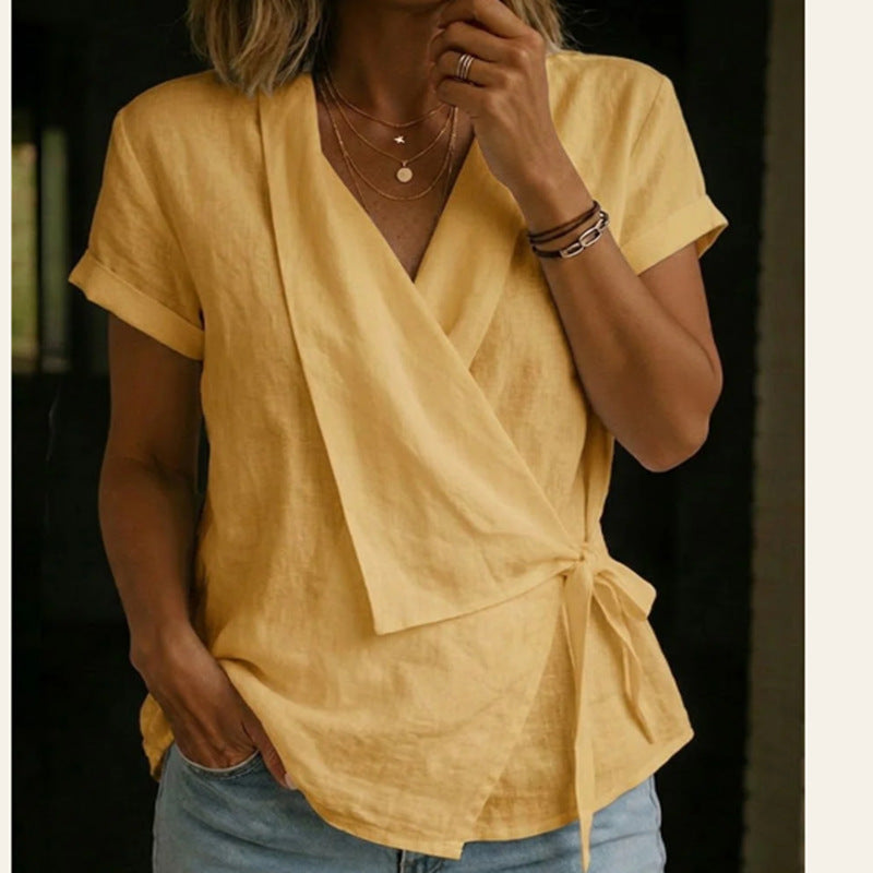 Person wearing a yellow top with a black background