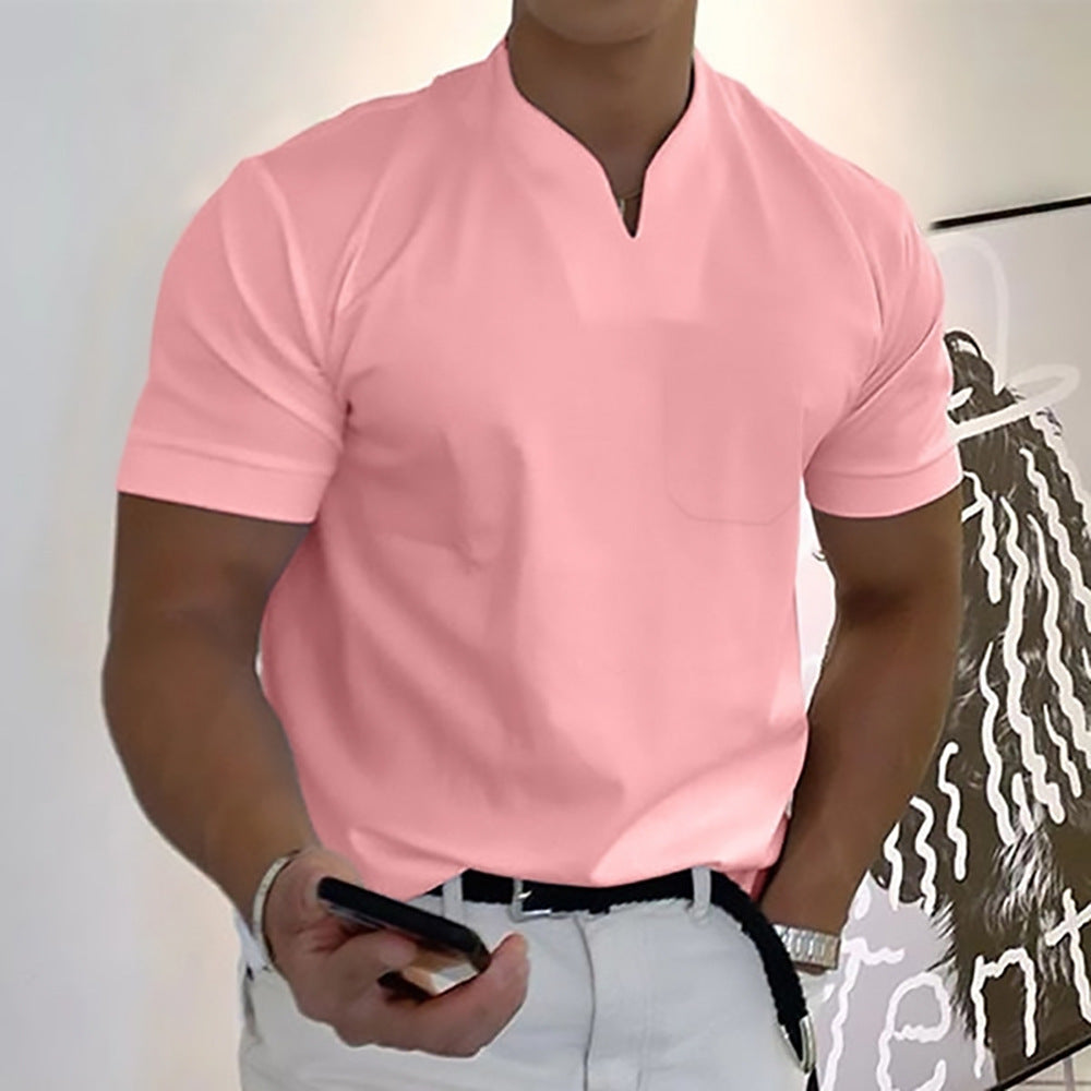 Person wearing a pink polo shirt with a white background