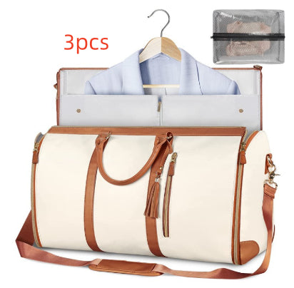 White travel bag with brown handles and trim, open to reveal clothes and a hanger, with '3pcs' text above.