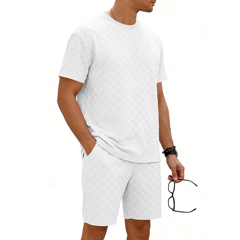 Man wearing a white t-shirt and shorts set on a white background