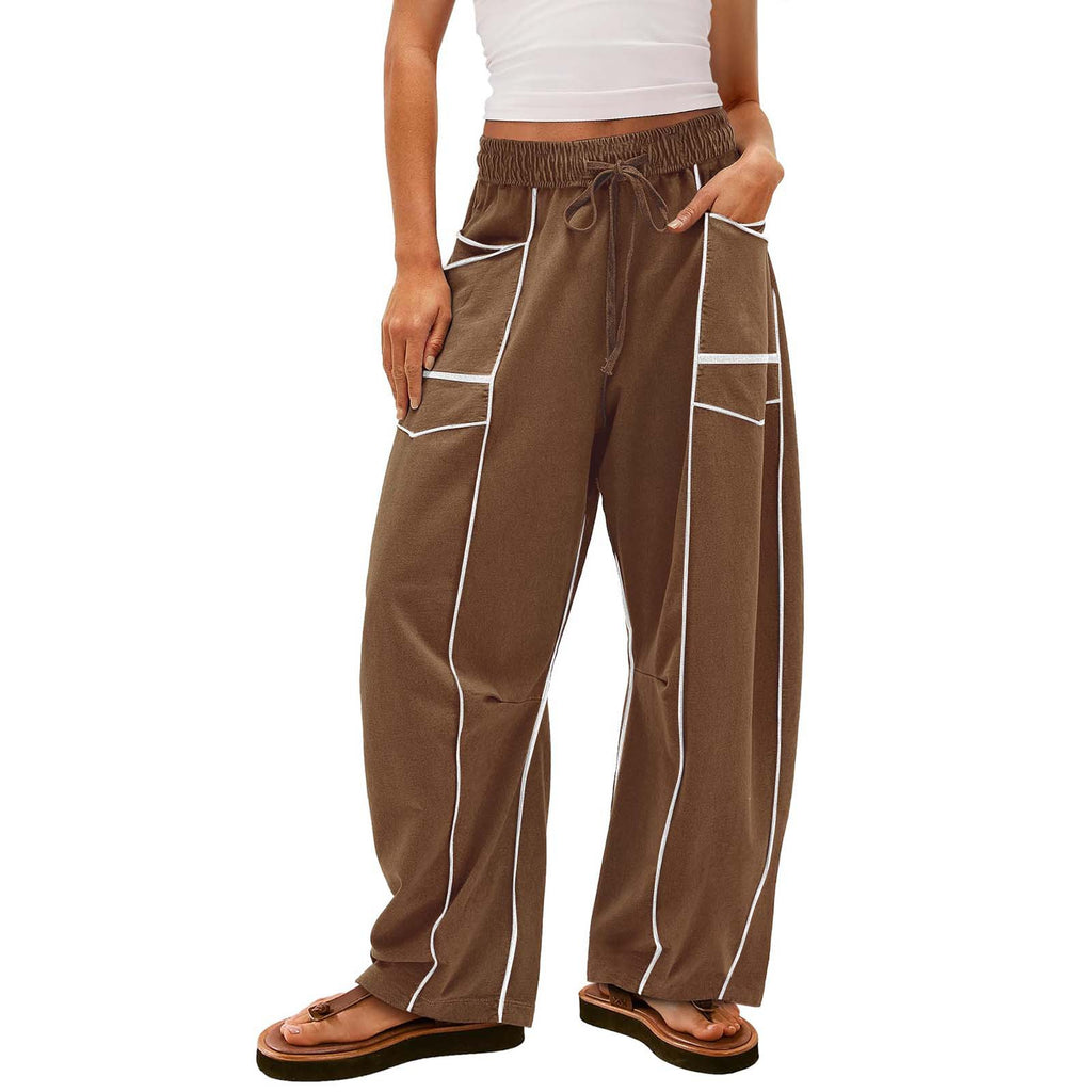 Brown pants with white stripes worn by a person on a white background