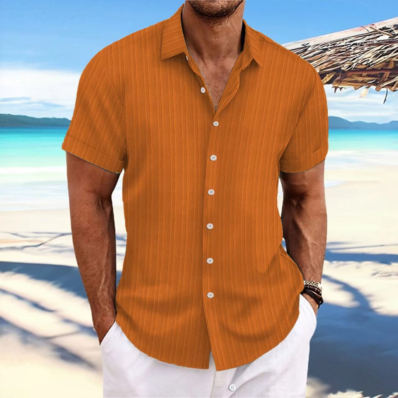 Man wearing an orange shirt with a beach background