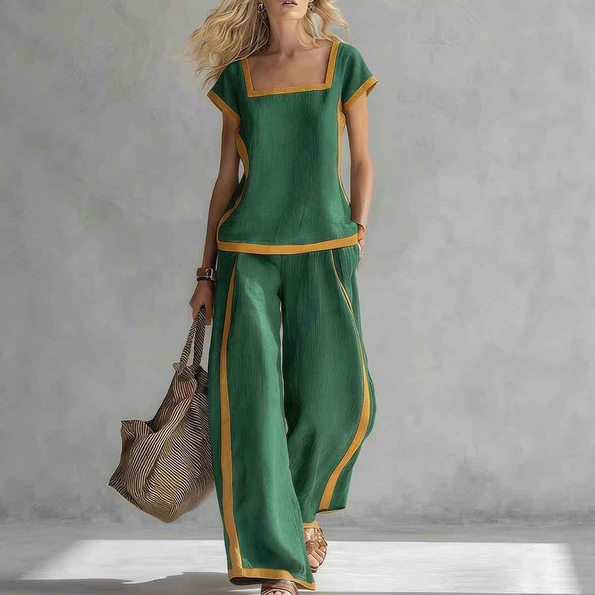 Woman wearing a green outfit with gold trim against a gray background
