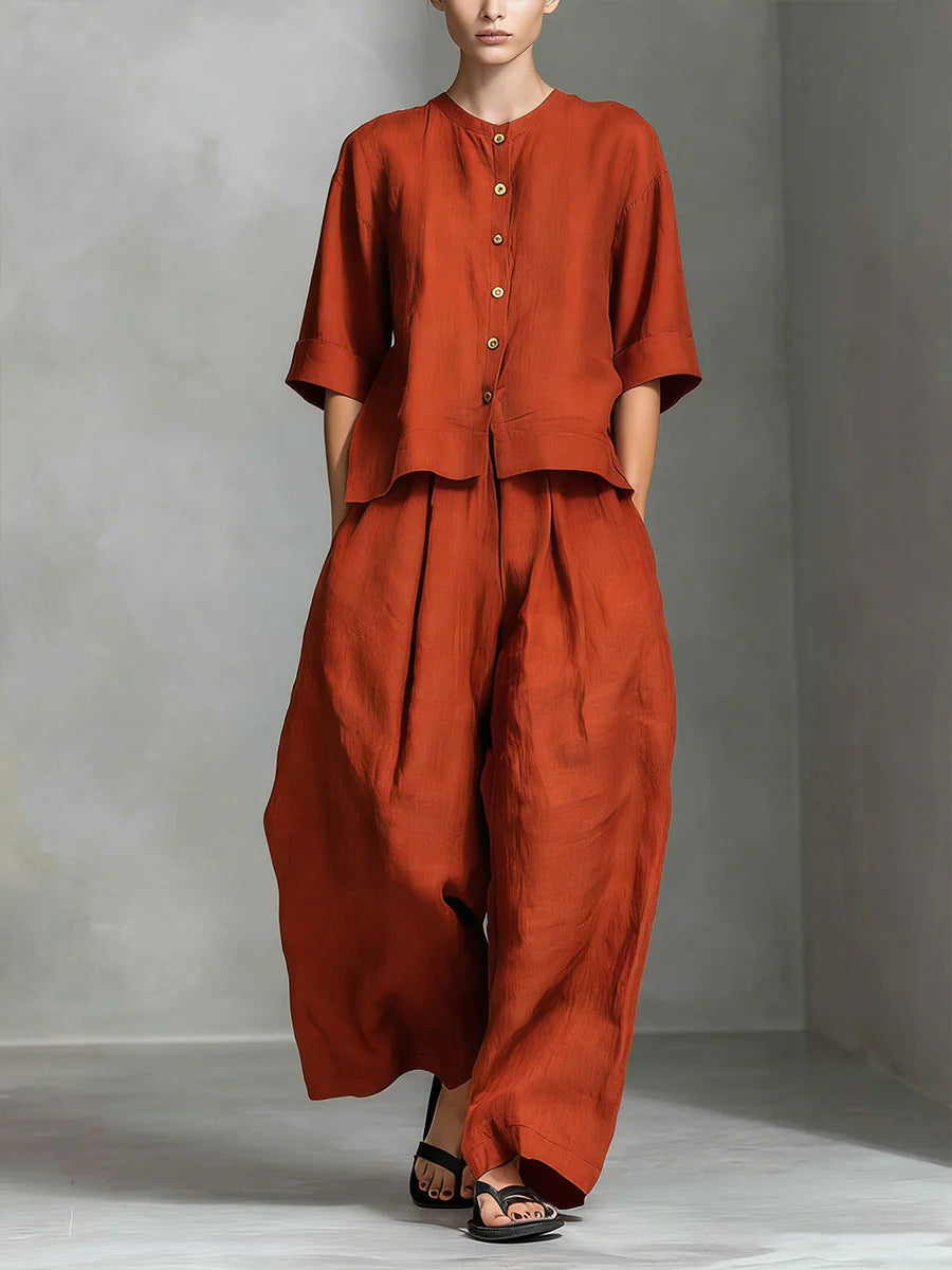 Person wearing a rust-colored outfit against a gray background